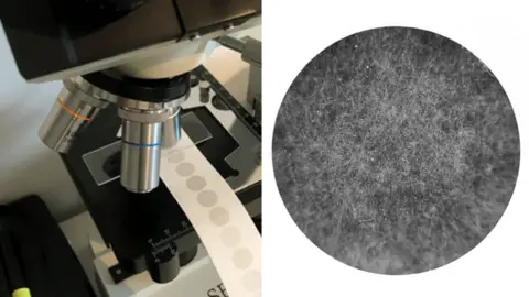 A composite image of a microscope with sample paper of air pollutions, and a digital photo of the air pollution sample