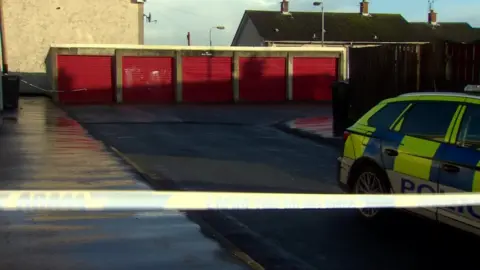 Police at the scene in the Ballybeen estate