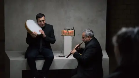 Hugo Glendinning/Taryn Simon Projects Anibal Gonzalez from Ecuador plays an accordion