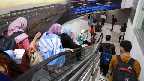 Government of Mexico A group of 175 Afghan citizens arriving at the Mexico City International Airport.