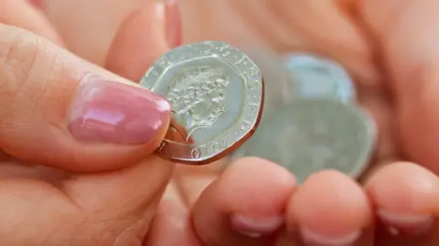 Getty Images 20p coin in hand