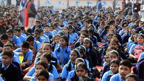 Getty Images Students listen to a lecture on menstrual health and hygiene on December 17, 2018 in Pune