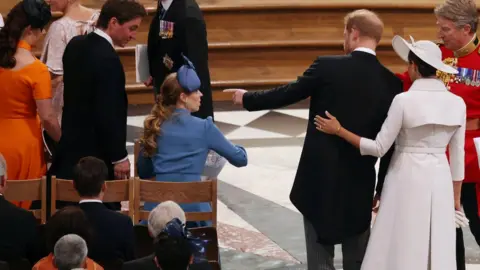 Reuters Prince Harry and Meghan take their seats at St Paul's