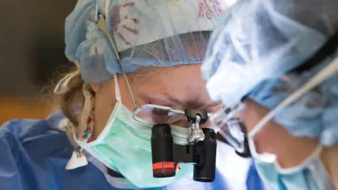 Washington University/ St. Louis Dr Mackinnon in her surgical scrubs