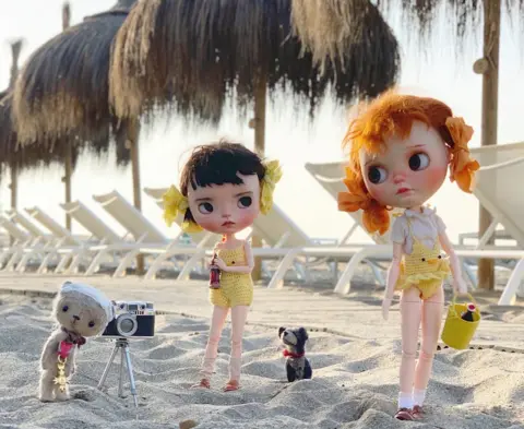 Eileen Lam The dolls and Ted on the beach