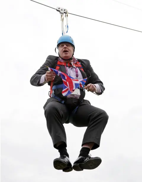 Getty Images Boris Johnson on a zip wire