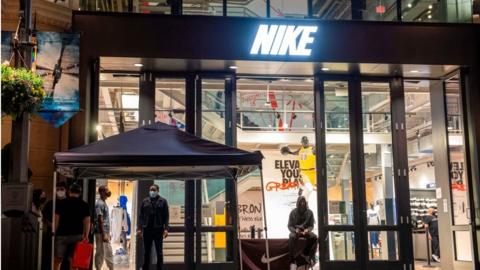 Nike sues over 'Satan Shoes' with human blood - BBC News