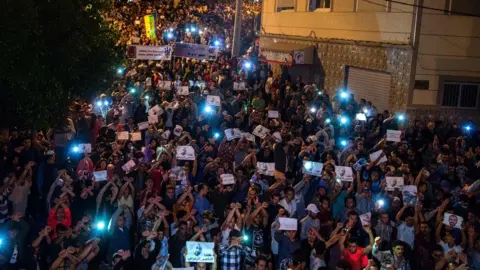 AFP Demonstrators hold pictures of Nasser Zafzafi during a demonstration in the northern city of al-Hoceima on May 30, 2017