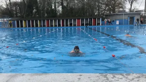 Chris Slegg/BBC Swimmers return to the water at Tooting Bec Lido