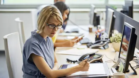 Getty Images Office workers