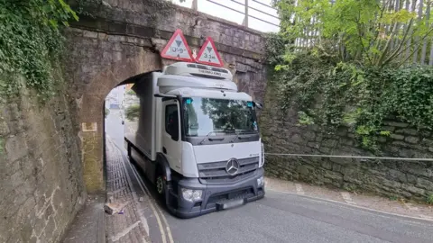 BBC Lorry stuck under bridge