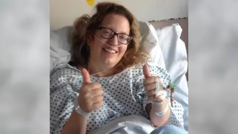 Louise Worthington A woman in a hospital bed