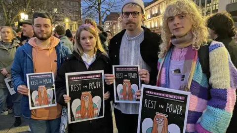 PA Media Members of the public attend a a candle-lit vigil at Belfast City Hall, in memory of transgender teenager Brianna Ghey, who was fatally stabbed in a park on Saturday