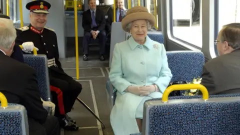 PA Images/Alamy Stock Photo The Queen sits on a seat on a Metro Carriage