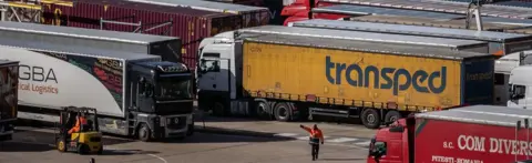 Getty Images Lorries are directed as they arrive and depart from Dover Ferry Terminal on 26 April