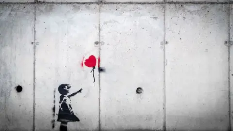 Unsplash Banksy image