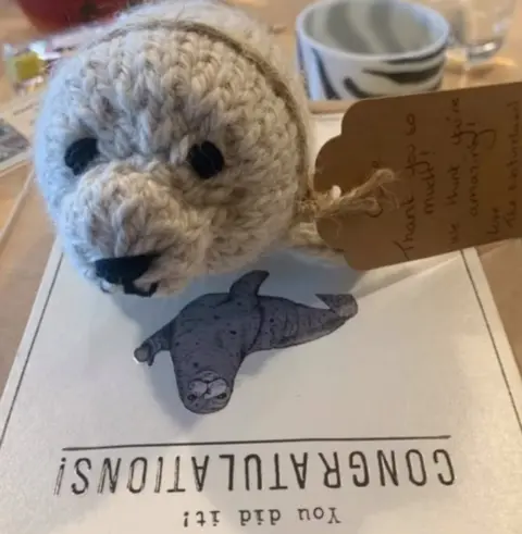 Kaitlynn Ollie was thanked with a hand-made seal teddy made from the wool of an Alpaca from the Natureland Seal Sanctuary