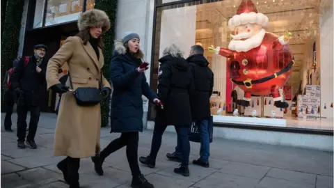 Getty Images Christmas shoppers on Oxford Street