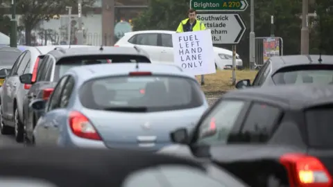 Getty Images Cars queuing for fuel in Brighton on Saturday