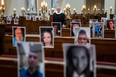 Getty Images Church in Copenhagen filled with photos of worshippers