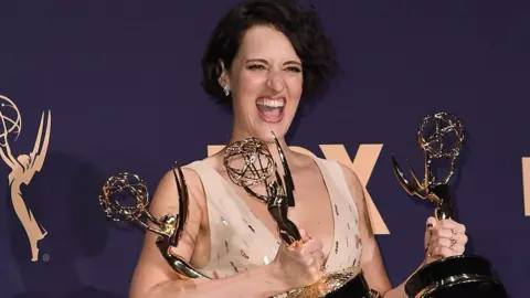 AFP Phoebe Waller-Bridge holding her Emmys