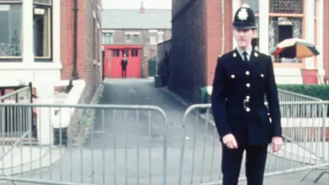 Police officer at scene of shooting