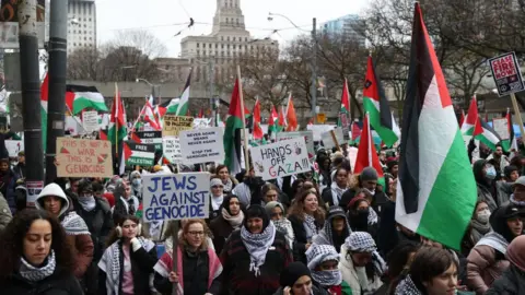 Getty Images Pro-Palestinian demonstrators attend a rally in Toronto, Ontario on December 2, 2023.