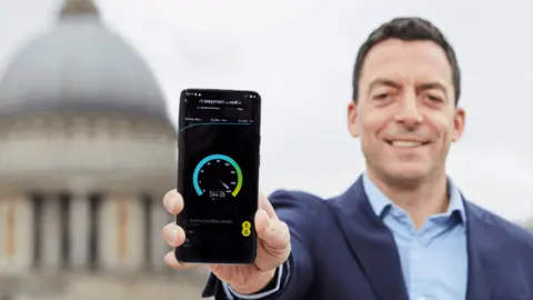 EE BT's Marc Allera with speed test on phone