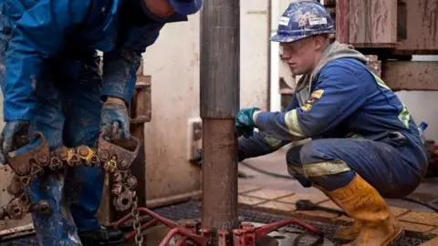 Getty Images Engineers on the drilling platform at a shale fracking facility in Preston, Lancashire