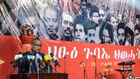 Getty Images Chairman of the Tigray People's Liberation Front (TPLF) Debretsion Gebremichael delivers a speech during the TPLF First Emergency General Congress in Mekelle, Ethiopia, on January 4, 2020