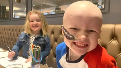 Chris Watt Mason McKenzie with his cousin Olivia Burns