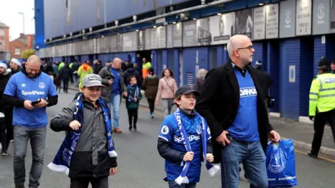 PA Media Everton fans arrive ahead of the Premier League match at Goodison Park