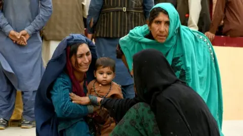 Reuters Relatives react in front of a hospital, where their family member has been transferred for treatment after a truck bomb blast in Balkh province, in Mazar-i-Sharif, Afghanistan. Photo: 25 August 2020