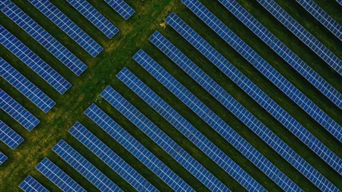 Getty Images Aerial view of solar panel farm