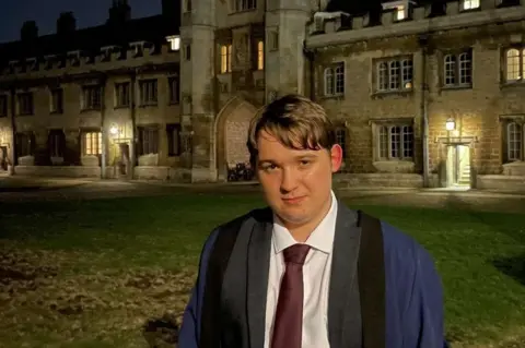 George Baldock George in his robes outside the University of Cambridge