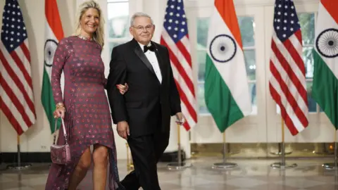 Getty Images Senator Robert Menendez, a Democrat from New Jersey, right, and Nadine Menendez arrive to attend a state dinner in honor of Indian Prime Minister Narendra Modi hosted by US President Joe Biden and First Lady Jill Biden at the White House in Washington, DC, US, on Thursday, June 22, 2023