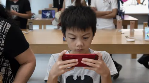 Getty Images Child with mobile phone