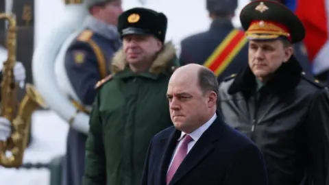 Reuters Ben Wallace at a wreath-laying ceremony in Russia
