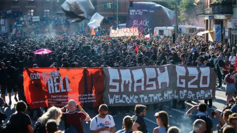 Reuters Protesters on the "Welcome to Hell" march