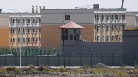 Getty Images This photo taken on June 2, 2019, shows buildings at the Artux City Vocational Skills Education Training Service Center, believed to be a re-education camp where mostly Muslim ethnic minorities are detained, north of Kashgar in China's north-western Xinjiang region.