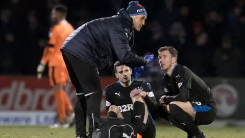 Rangers' Jamie Murphy is injured against St Johnstone