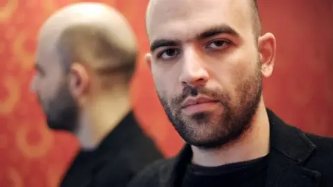 Getty Images Italian writer Roberto Saviano poses during a photo session in Rome, 17 March 2010