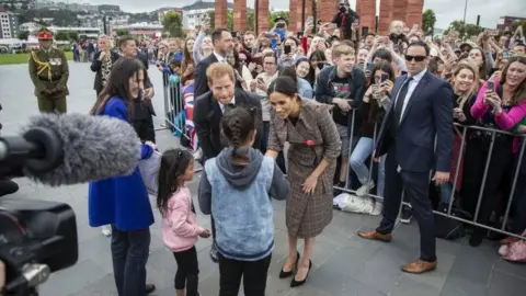 EPA Prince Harry, Duke of Sussex and his wife Meghan, Duchess of Sussex (C-R) greet the crowd at Pukeahu National War Memorial Park in Wellington, New Zealand, 28 October 2018