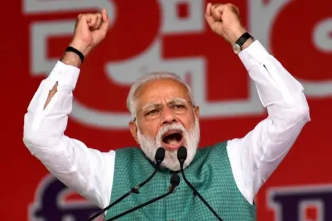 AFP Indian Prime Minister Narendra Modi gestures as he speaks during the National Democratic Alliance (NDA) "Sankalp" rally in Patna in the Indian eastern state of Bihar on March 3, 2019.