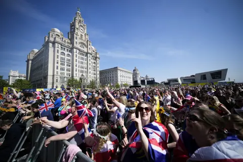 Christopher Furlong / Getty Images Eurovision fans gather to watch the final on a giant screen in the Eurovision Village