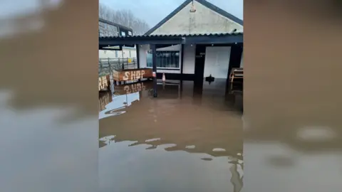 BBC Flood water outside the cafe