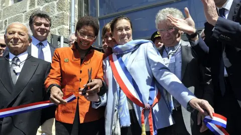 AFP Le Chambon-sur-Lignon's former mayor Eliane Wauquiez-Motte, along with other officials, cut tape in 2013