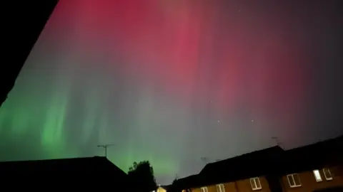 Stacey Northern lights over residential houses in Belper