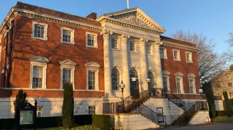 External view of Warrington Town Hall in Warrington, Cheshire, on a sunny day.