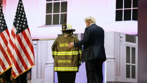 Trump on stage at the RNC wearing Corey Comperatore's jacket